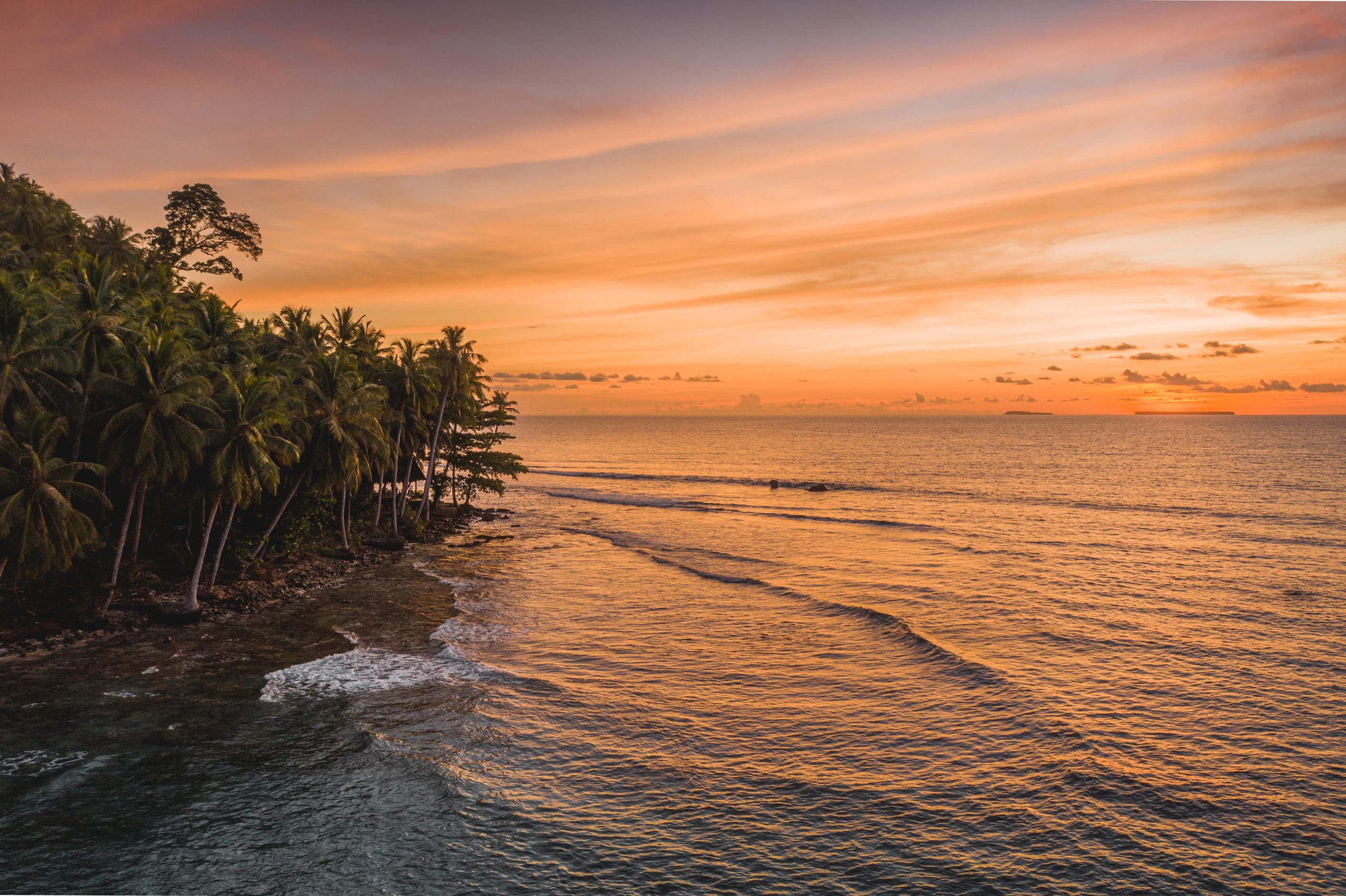 mesmerizing-view-calm-ocean-trees-shore-sunset-indonesia-2-2